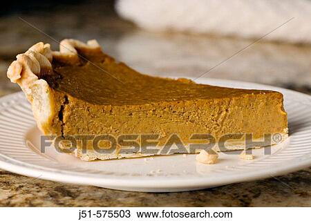 Food. Riverwoods, Illinois. One slice of homemade pumpkin pie and crumbs on white plate white napkin on granite counter top View Large Photo Image Stock Image - Food. Riverwoods, Illinois. One slice of homemade pumpkin pie and crumbs on white plate white napkin on granite counter top. Fotosearch