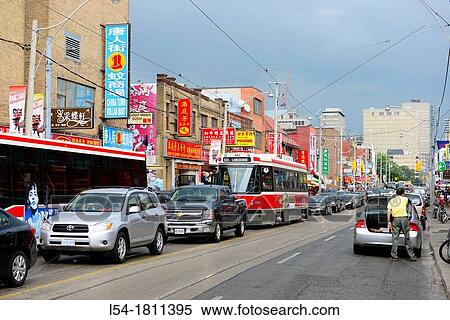 Stock Photography - Food Vendors Chinatown Spadina Avenue Toronto Ontario Canada with colorful signs. Fotosearch