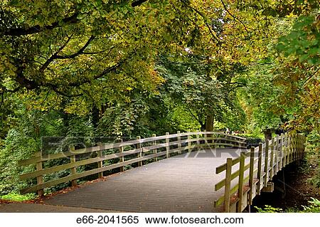 Foot bridge in the Stads Park in Maastricht's old city. Leaves are beginning to change colour in autumn. View Large Photo Image Stock Photography - Foot bridge in the Stads Park in Maastricht's old city. Leaves are beginning to change colour in autumn.. Fotosearch