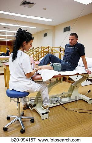 Stock Photo - Foot mobilization, reeducation exercise, rebahilitation. Policlinica Gipuzkoa, San Sebastian, Donostia, Euskadi, Spain. Fotosearch