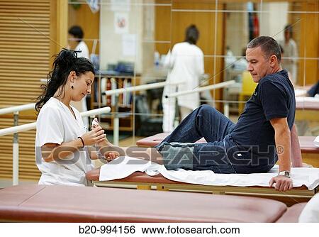 Stock Photograph - Foot mobilization, reeducation exercise, rebahilitation. Policlinica Gipuzkoa, San Sebastian, Donostia, Euskadi, Spain. Fotosearch
