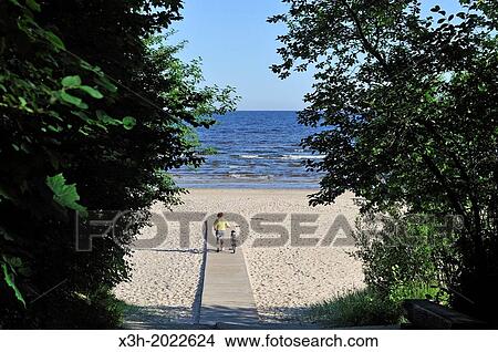 Picture - footwalk on a beach of Jurmala, Gulf of Riga, Latvia, Baltic region, Northern Europe.. Fotosearch