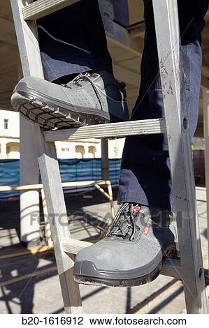Footwear for professional use, Protective boots, construction worker, Ladder, Donostia, San Sebastian, Gipuzkoa, Basque Country, Spain View Large Photo Image Stock Image - Footwear for professional use, Protective boots, construction worker, Ladder, Donostia, San Sebastian, Gipuzkoa, Basque Country, Spain. Fotosearch