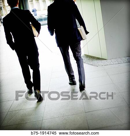 foreground of two executives walking around the City of London, England, UK View Large Photo Image Stock Photography - foreground of two executives walking around the City of London, England, UK. Fotosearch