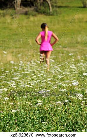 foreground of white flowers with a girl walking backwards on the bottom View Large Photo Image Stock Image - foreground of white flowers with a girl walking backwards on the bottom. Fotosearch