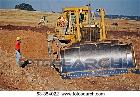Stock Image - Foreman checking excavating project. Lincoln. California. USA.. Fotosearch