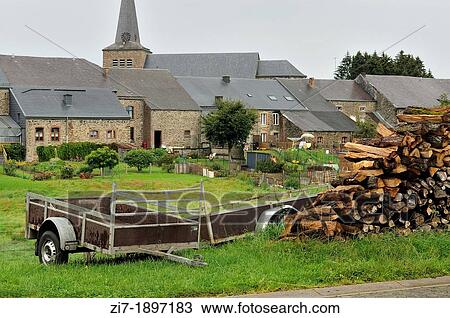 foreshortening of stack of wood and old carts in agricultural village, shot in typical cloudy light View Large Photo Image Stock Image - foreshortening of stack of wood and old carts in agricultural village, shot in typical cloudy light. Fotosearch
