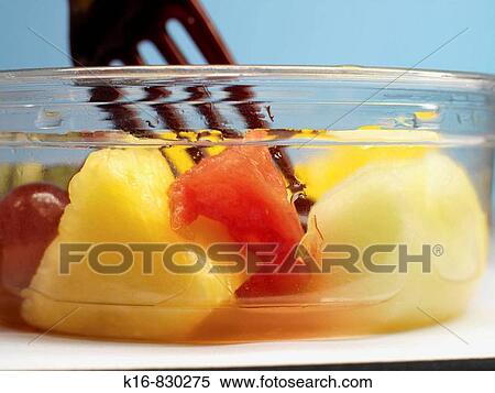 fork and cut fruit in container View Large Photo Image Stock Photography - fork and cut fruit in container. Fotosearch