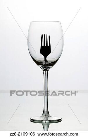Fork through an empty glass. View Large Photo Image Stock Photograph - Fork through an empty glass.. Fotosearch