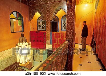 Stock Image - former palace housing a shop and carpet factory, medina of Marrakech, Atlas, Morocco, North Africa. Fotosearch