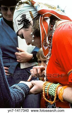Fortune teller at the local fair reading palms View Large Photo Image Stock Image - Fortune teller at the local fair reading palms. Fotosearch