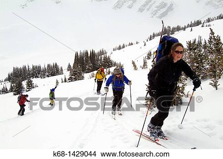 forty year old woman skis with a group in Banff National Park, Alberta, Canada View Large Photo Image Picture - forty year old woman skis with a group in Banff National Park, Alberta, Canada. Fotosearch