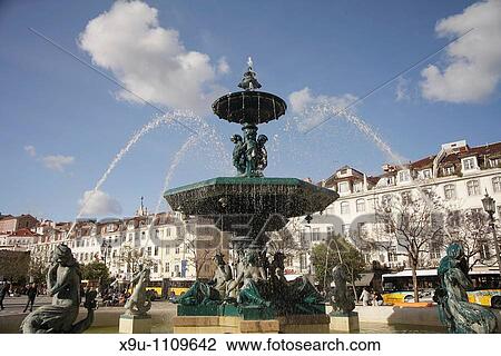 fountain on the square Praca de Dom Pedro IV or Rossio in Lisbon, Portugal, Europe View Large Photo Image Stock Image - fountain on the square Praca de Dom Pedro IV or Rossio in Lisbon, Portugal, Europe. Fotosearch