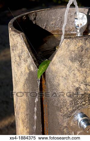 Stock Photography - Fountain published with a sheet Fountain designed to use only people but with a simple sheet becomes drinker for dogs Barcelona's 1645 public fountains are a source of drinking water Photo take at Parc del Carmel, Barcelona, Spain, Europe. Fotosearch