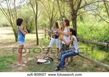 four girls clapping to a friend View Large Photo Image Stock Photo - four girls clapping to a friend. Fotosearch