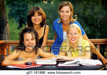 four multi-cultural woman, mothers and daughter at outdoor table helping with studies View Large Photo Image Stock Photograph - four multi-cultural woman, mothers and daughter at outdoor table helping with studies. Fotosearch