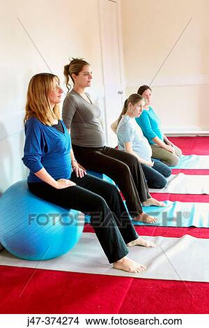 Four pregnant ladies in a pre natal yoga class View Large Photo Image Picture - Four pregnant ladies in a pre natal yoga class. Fotosearch