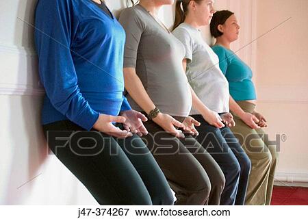 Four pregnant ladies in a pre natal yoga class View Large Photo Image Stock Photo - Four pregnant ladies in a pre natal yoga class. Fotosearch