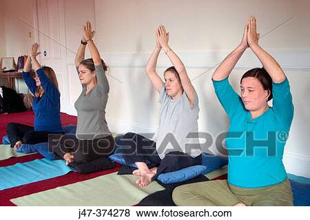 Stock Photo - Four pregnant ladies in a pre natal yoga class. Fotosearch