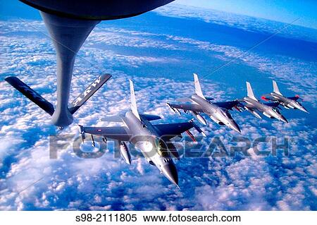 Four Royal Danish air force pilots fly F-16 Fighting Falcons in formation behind a 100th Air Refueling Wing KC-135 Stratotanker during a refueling mission over Denmark Dec. 8, 2009. View Large Photo Image Stock Photography - Four Royal Danish air force pilots fly F-16 Fighting Falcons in formation behind a 100th Air Refueling Wing KC-135 Stratotanker during a refueling mission over Denmark Dec. 8, 2009.. Fotosearch