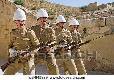 Four soldiers holding their rifles with fixed bayonets, Fort Rinella, Kalkara, Malta View Large Photo Image Stock Photo - Four soldiers holding their rifles with fixed bayonets, Fort Rinella, Kalkara, Malta. Fotosearch