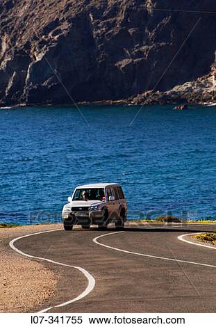 Four-wheel drive on winding road. Cabo de Gata. Andalucia. Spain View Large Photo Image Stock Photography - Four-wheel drive on winding road. Cabo de Gata. Andalucia. Spain. Fotosearch