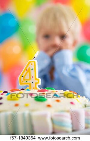 Four year old boy celebrating his birthday View Large Photo Image Picture - Four year old boy celebrating his birthday. Fotosearch