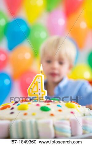 Four year old boy celebrating his birthday View Large Photo Image Stock Image - Four year old boy celebrating his birthday. Fotosearch