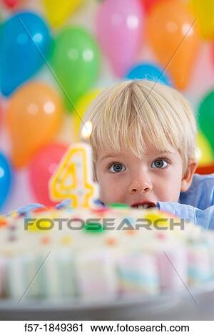 Four year old boy celebrating his birthday View Large Photo Image Stock Image - Four year old boy celebrating his birthday. Fotosearch