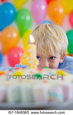 Four year old boy celebrating his birthday View Large Photo Image Stock Image - Four year old boy celebrating his birthday. Fotosearch