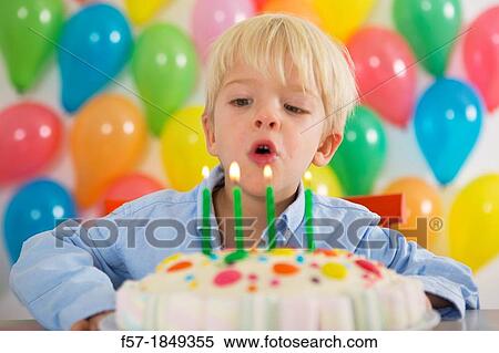 Four year old boy celebrating his birthday View Large Photo Image Stock Photography - Four year old boy celebrating his birthday. Fotosearch
