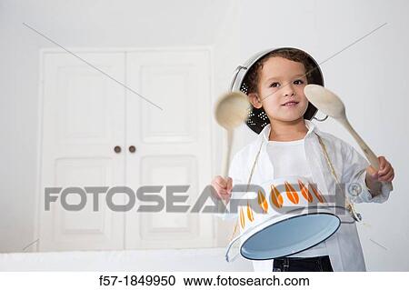 Four year old boy drumming on a saucepan View Large Photo Image Stock Image - Four year old boy drumming on a saucepan. Fotosearch