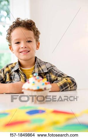 Four year old boy waiting for a cupcake View Large Photo Image Picture - Four year old boy waiting for a cupcake. Fotosearch