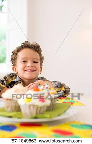 Four year old boy waiting for a cupcake View Large Photo Image Stock Image - Four year old boy waiting for a cupcake. Fotosearch