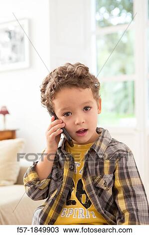 Four year old boy with cell phone View Large Photo Image Stock Image - Four year old boy with cell phone. Fotosearch