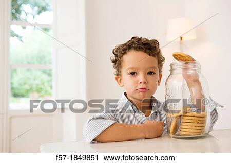 Four year old boy with his hand in the cookie jar View Large Photo Image Stock Image - Four year old boy with his hand in the cookie jar. Fotosearch