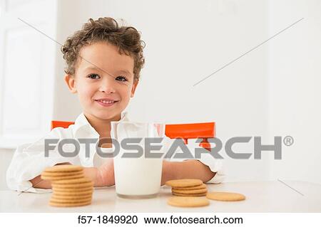 Four year old boy with milk and cookies for breakfast View Large Photo Image Stock Image - Four year old boy with milk and cookies for breakfast. Fotosearch