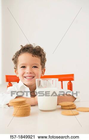 Four year old boy with milk and cookies for breakfast View Large Photo Image Stock Image - Four year old boy with milk and cookies for breakfast. Fotosearch