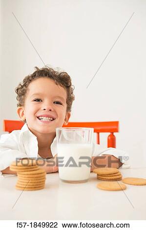 Four year old boy with milk and cookies for breakfast View Large Photo Image Stock Image - Four year old boy with milk and cookies for breakfast. Fotosearch