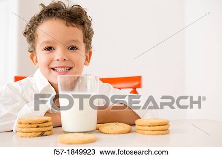 Four year old boy with milk and cookies for breakfast View Large Photo Image Stock Image - Four year old boy with milk and cookies for breakfast. Fotosearch
