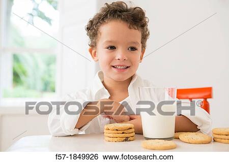 Four year old boy with milk and cookies for breakfast View Large Photo Image Stock Photograph - Four year old boy with milk and cookies for breakfast. Fotosearch