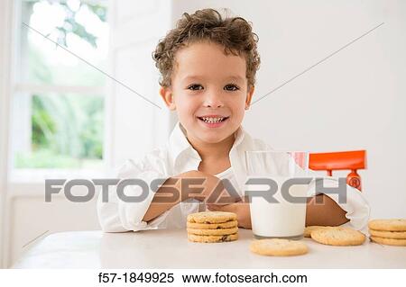 Four year old boy with milk and cookies for breakfast View Large Photo Image Stock Photography - Four year old boy with milk and cookies for breakfast. Fotosearch