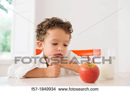 Four year old boy with milk and fruit for beakfast View Large Photo Image Picture - Four year old boy with milk and fruit for beakfast. Fotosearch