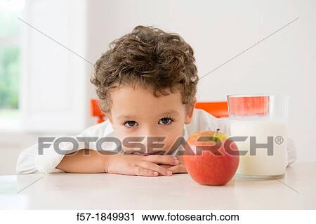Four year old boy with milk and fruit for beakfast View Large Photo Image Stock Image - Four year old boy with milk and fruit for beakfast. Fotosearch