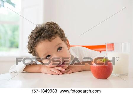 Four year old boy with milk and fruit for beakfast View Large Photo Image Stock Image - Four year old boy with milk and fruit for beakfast. Fotosearch