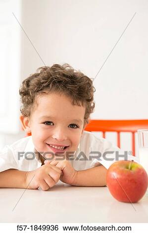 Four year old boy with milk and fruit for beakfast View Large Photo Image Stock Photograph - Four year old boy with milk and fruit for beakfast. Fotosearch
