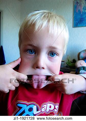 Stock Photo - four year old child put out tongue. Fotosearch