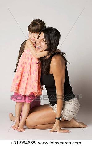 Four year old girl hugging her mother View Large Photo Image Stock Photography - Four year old girl hugging her mother. Fotosearch