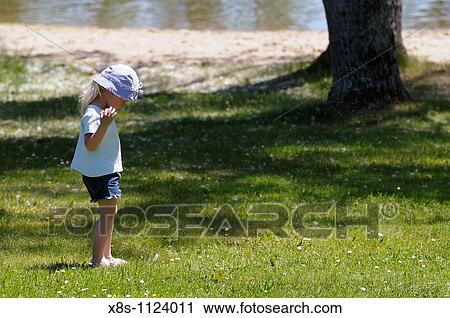 Four year old girl playing by herself near a beach View Large Photo Image Stock Image - Four year old girl playing by herself near a beach. Fotosearch