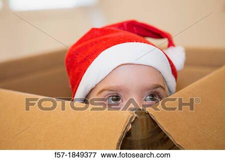 Four year old girl playing in a cardboard box at Christmas View Large Photo Image Stock Photo - Four year old girl playing in a cardboard box at Christmas. Fotosearch